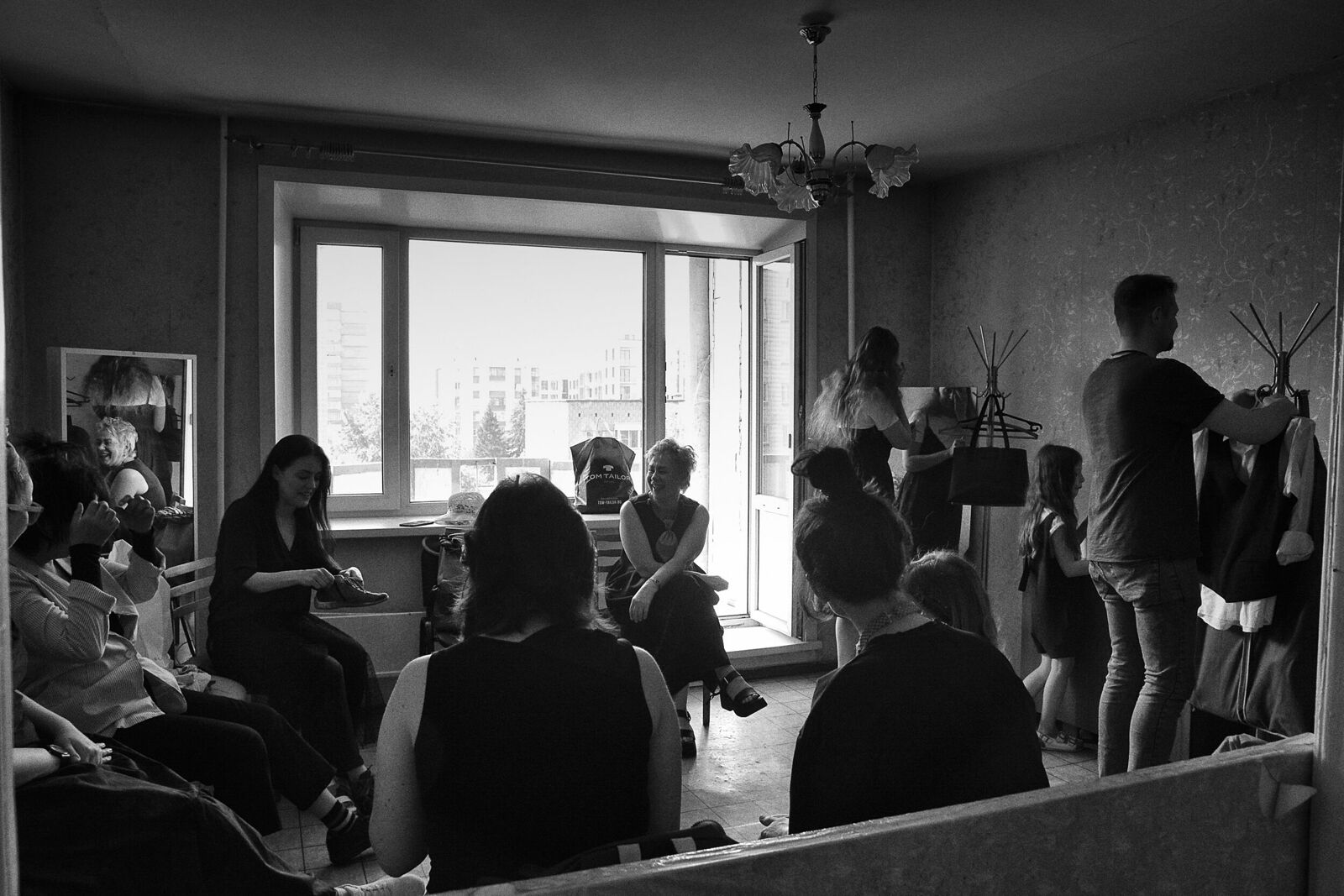 Artists of the Siberian Stupid Choir, the clown choir, make up and change clothes before performing at the Veterans House.